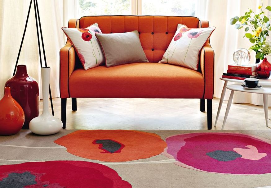 Wool rug with big orange pink and red flowers