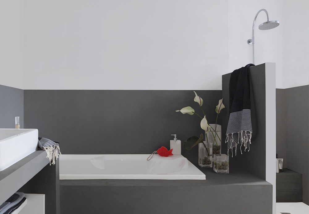 Bathroom with white walls and grey painted tiles