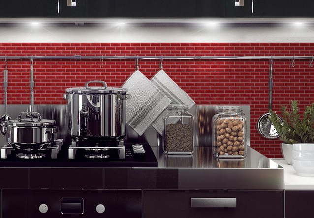 Red adhesive false wall tiles in a kitchen