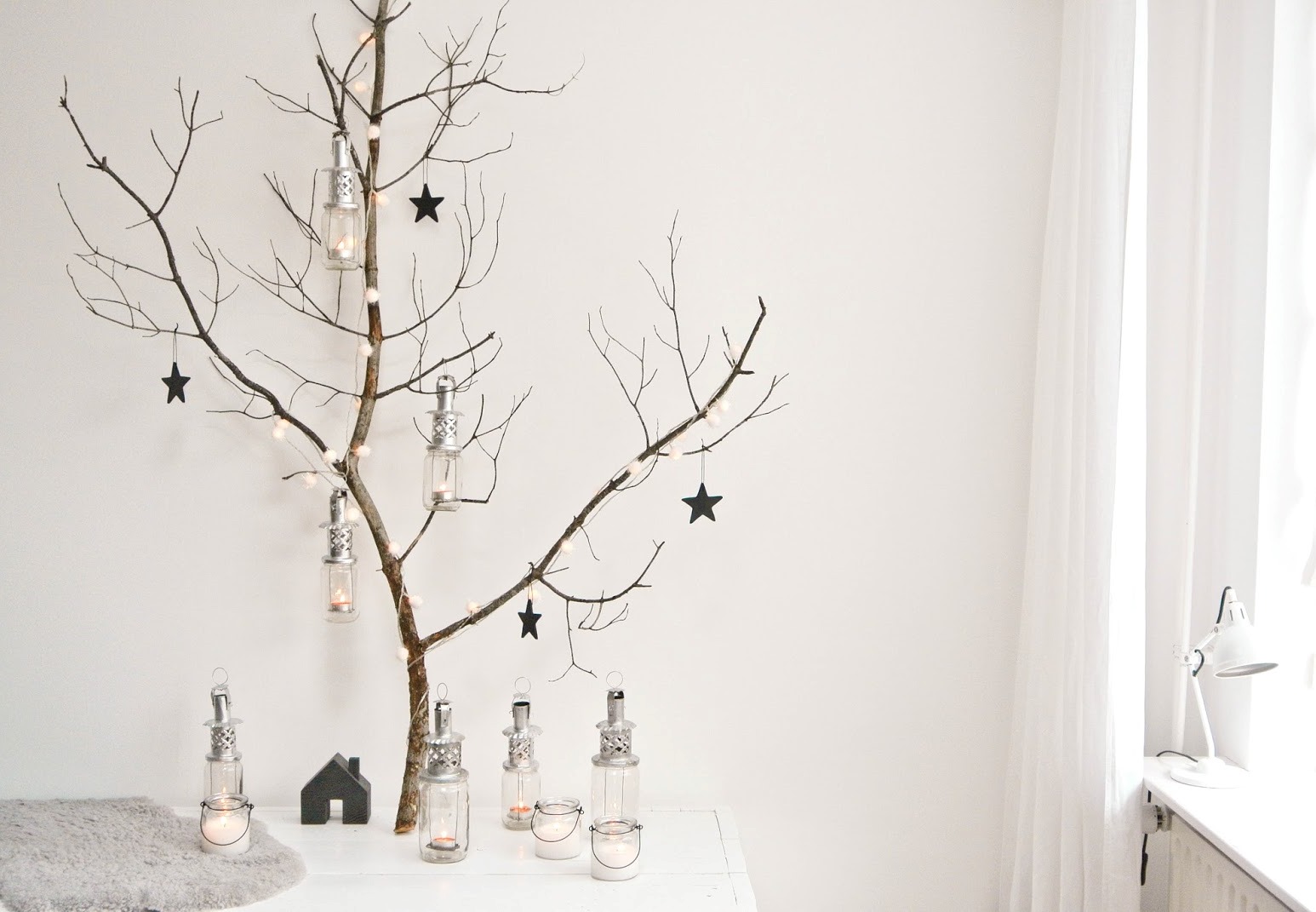 Small black stars on a branch for christmas decoration