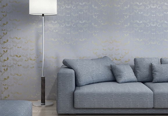 modern sofa in powder blue and wallpaper with golden patterns