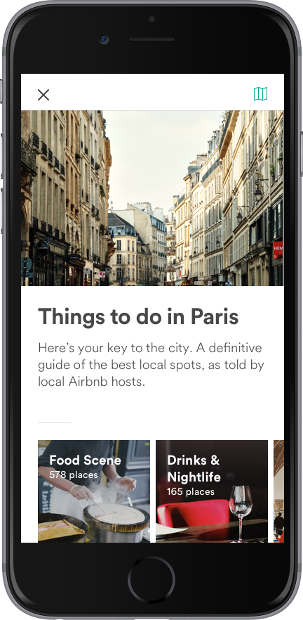 Smartphone screen with Airbnb Guidebooks for neighborhood